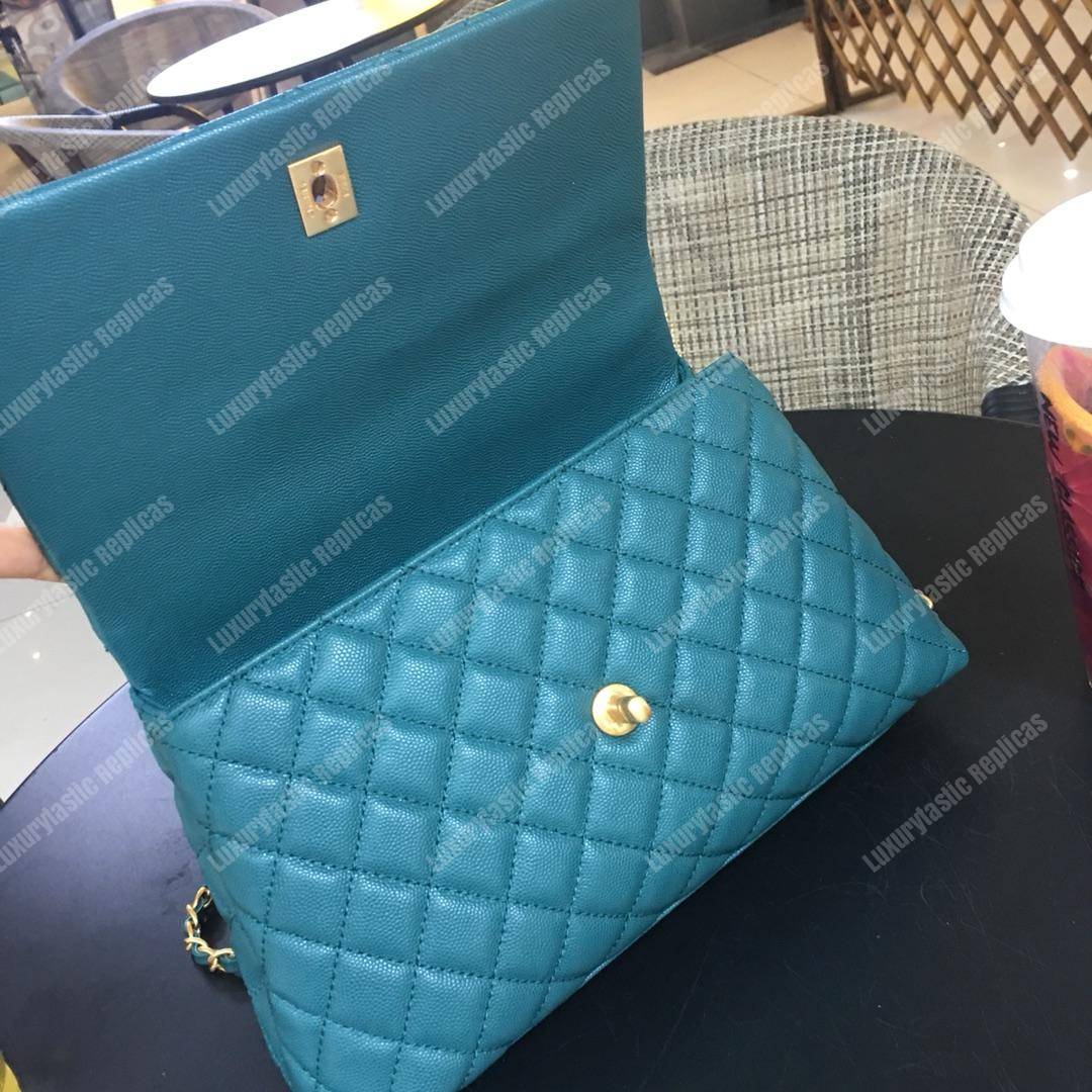 Ch*el flap bag with top handle blue