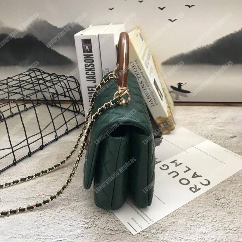 Ch*el flap bag with top handle green