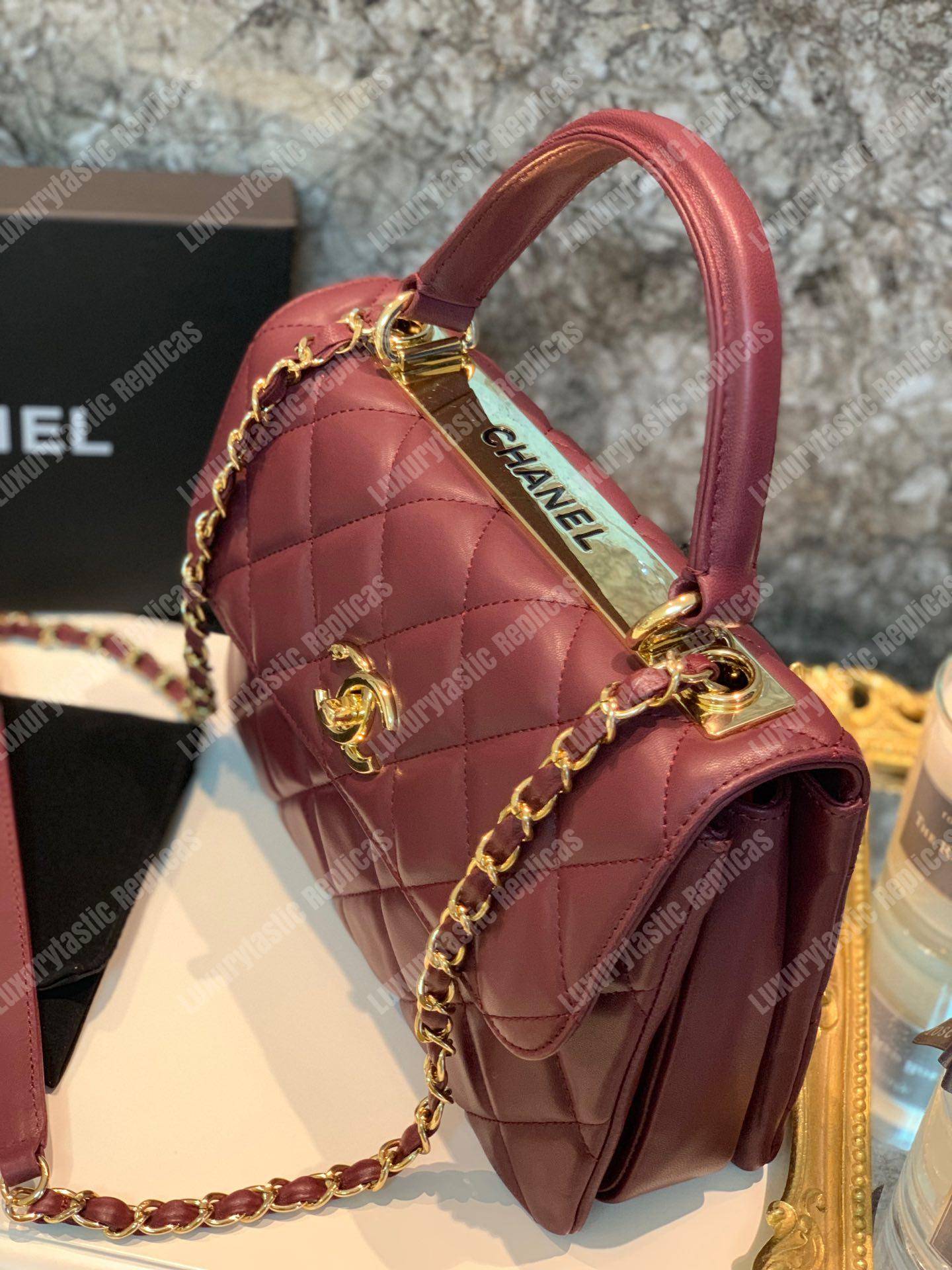 Ch*el small flap bag with top handle burgundy-gold