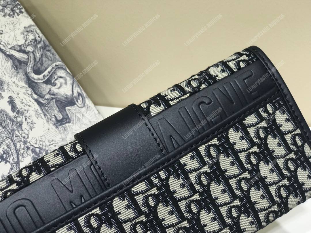 30 Montaigne Jacquard Canvas Clutch Bag Blue