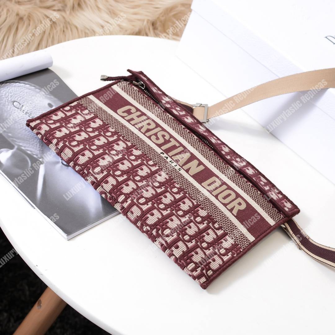 D*or burgundy oblique embroidered canvas clutch