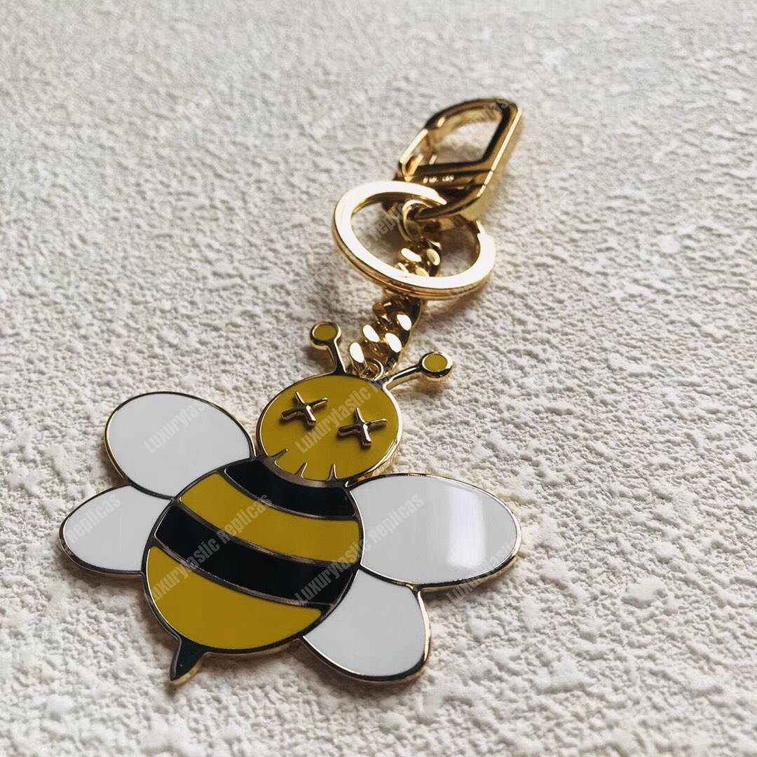 D*or x kaws bee key ring in brass & resin