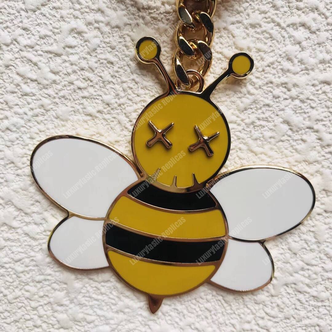 D*or x kaws bee key ring in brass & resin
