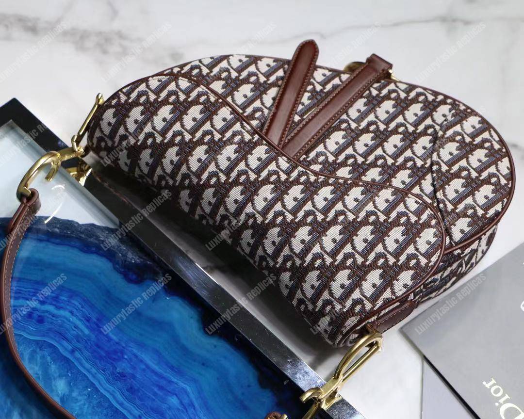 D*or burgundy oblique saddle bag