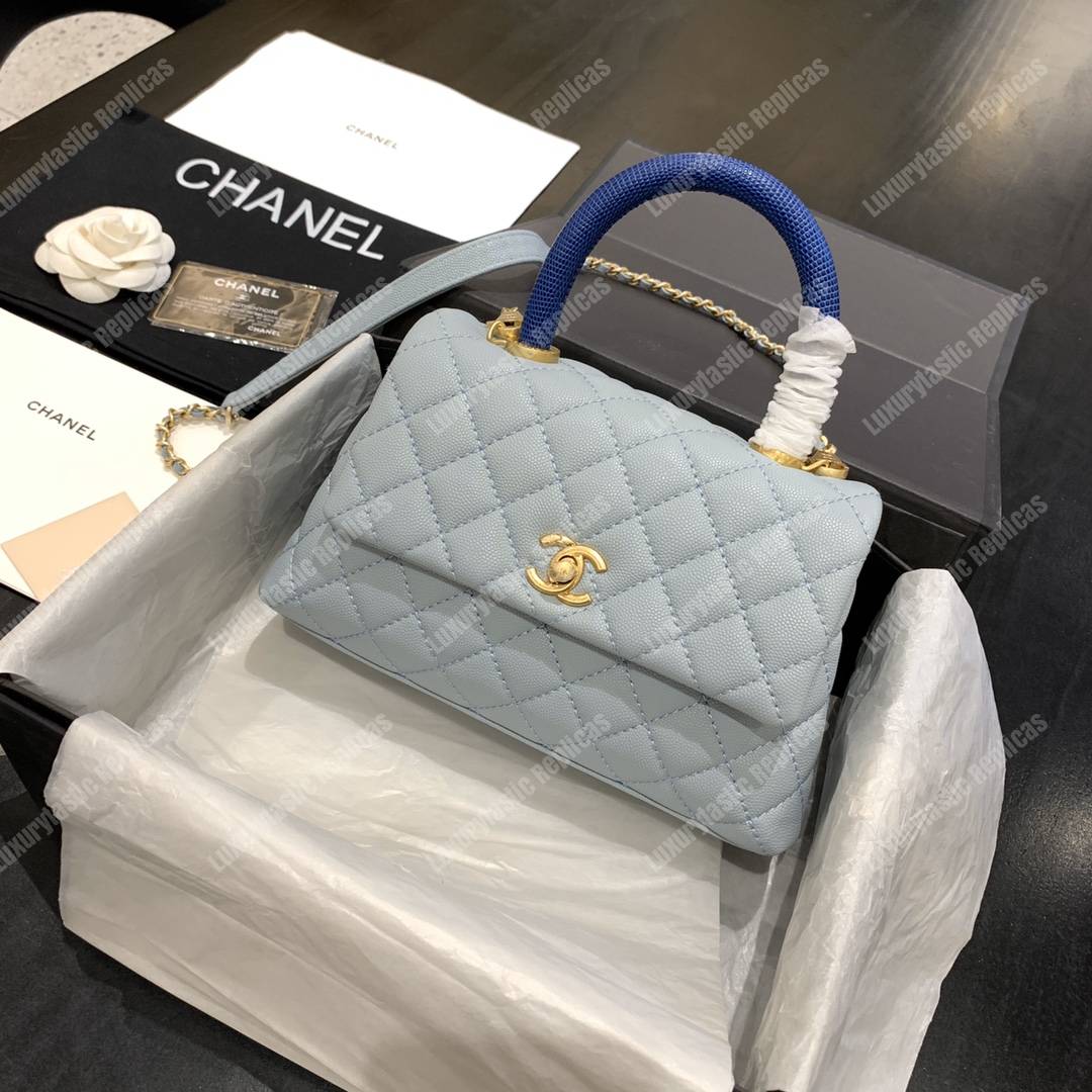 Ch*el flap bag with top handle caviar leather sky blue