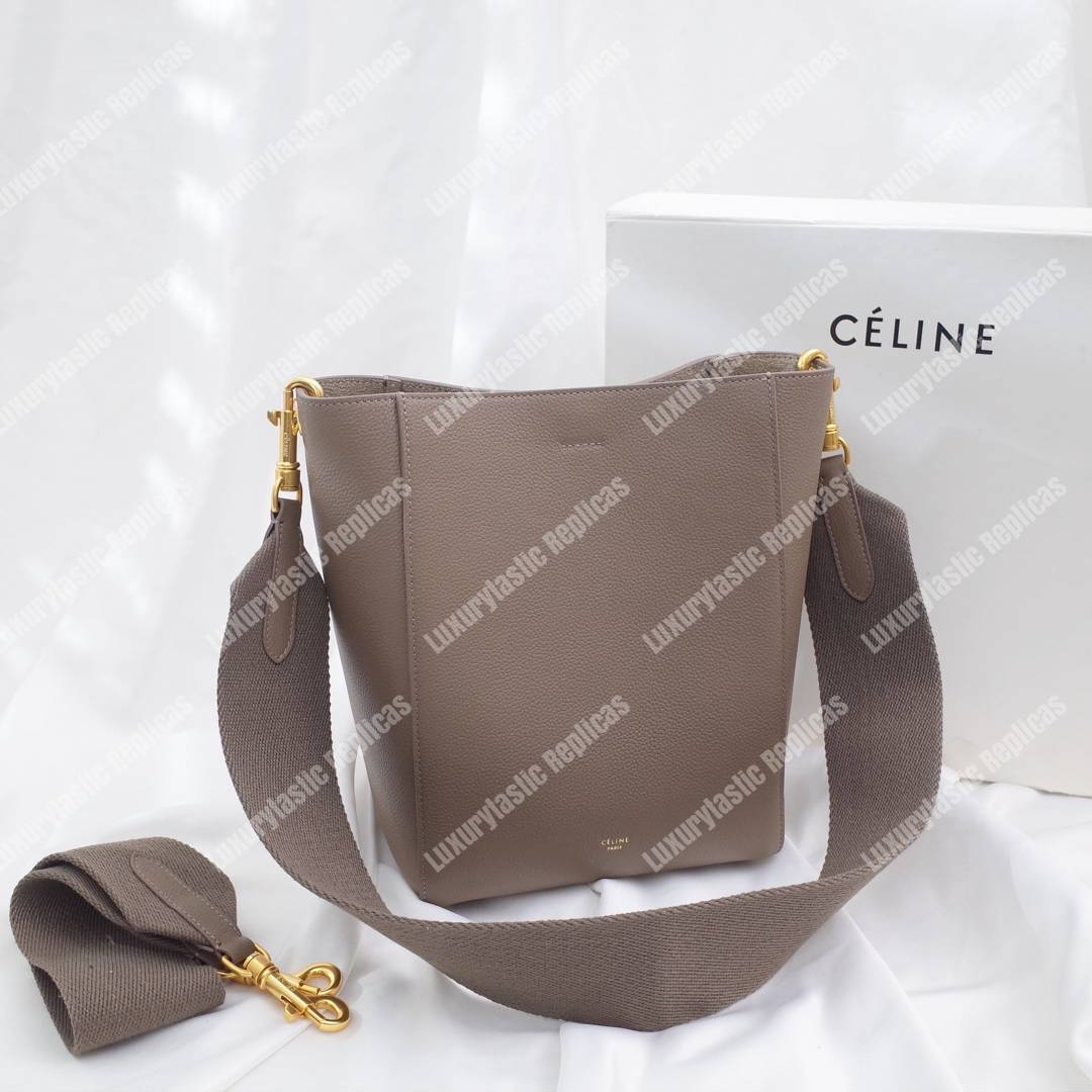 Ce**e sangle small bucket bag in soft grained calfskin taupe