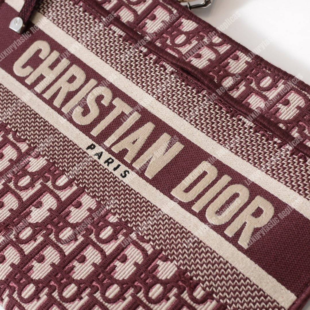 D*or burgundy oblique embroidered canvas clutch