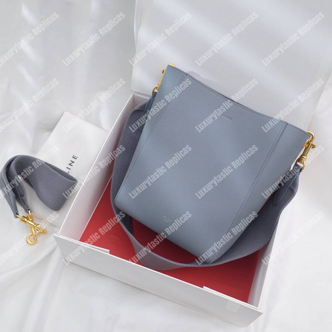 Ce**e sangle small bucket bag in soft grained calfskin cloud