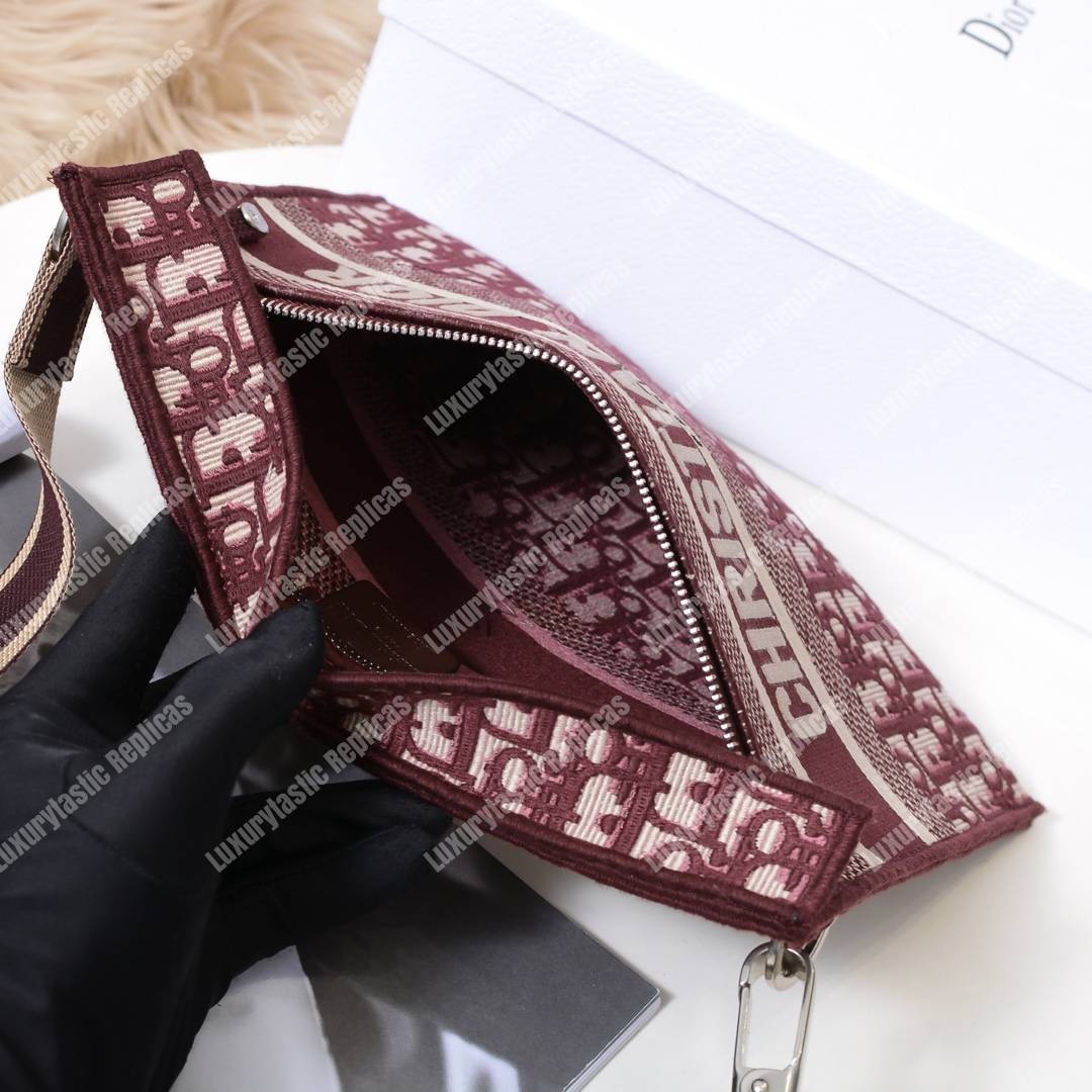 D*or burgundy oblique embroidered canvas clutch