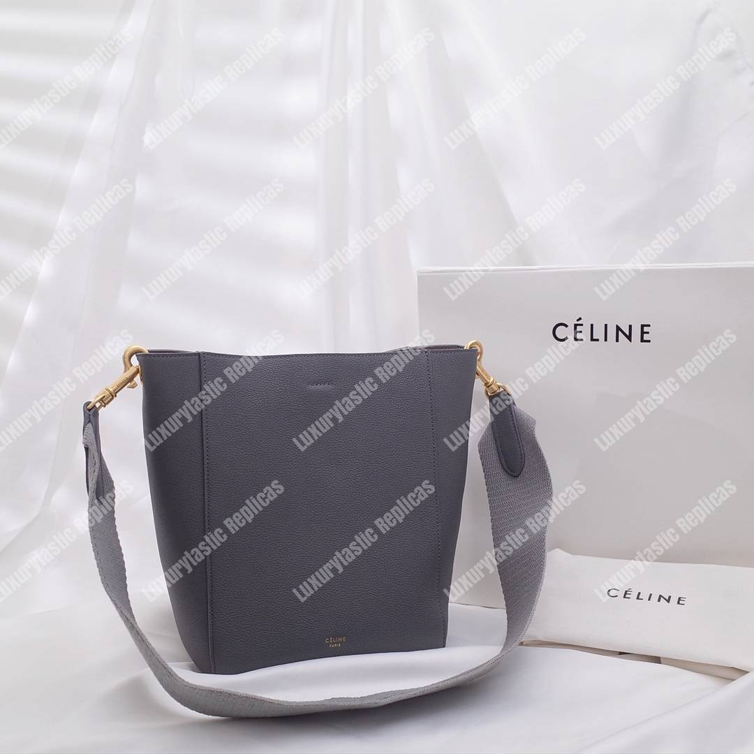 Ce**e sangle small bucket bag in soft grained calfskin grey