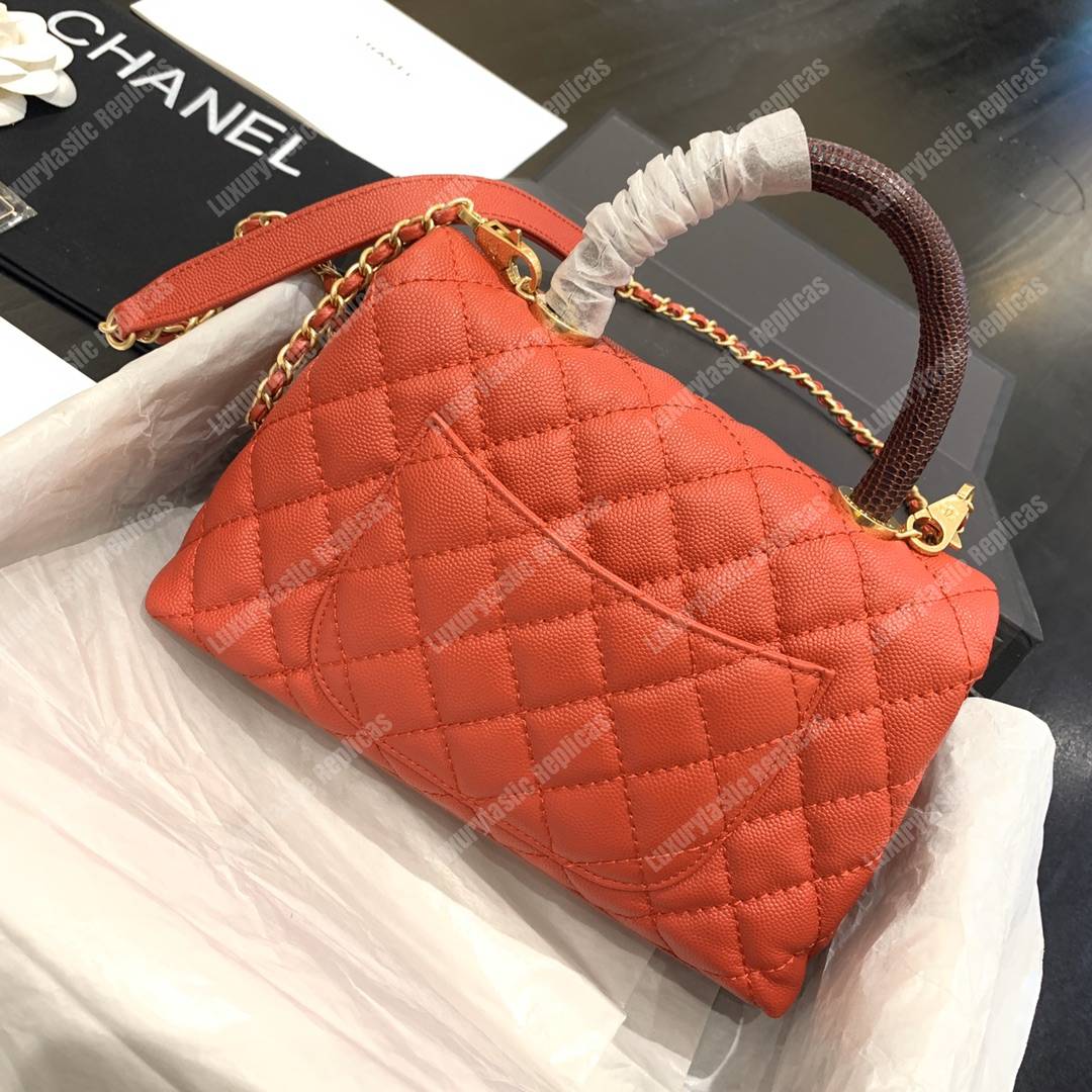 Ch*el flap bag with top handle orange