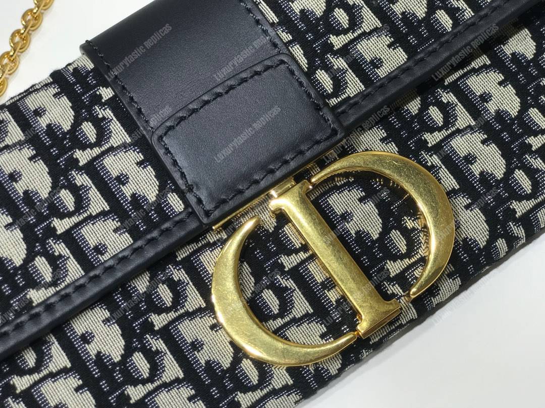 30 Montaigne Jacquard Canvas Clutch Bag Blue