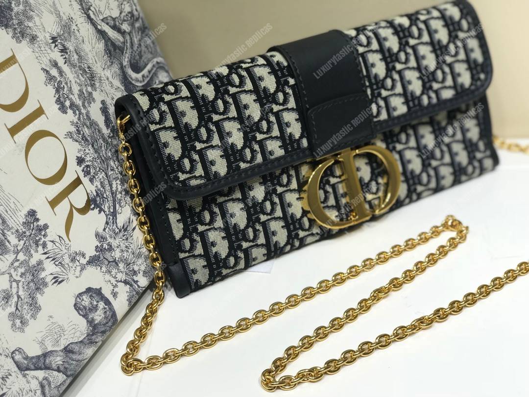 30 Montaigne Jacquard Canvas Clutch Bag Blue