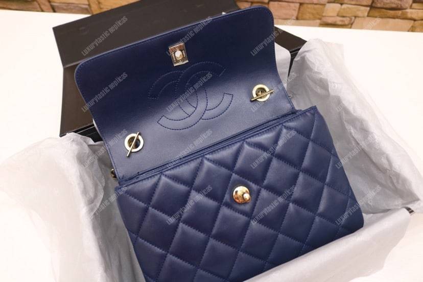 Ch*el small flap bag with top handle navy blue-gold