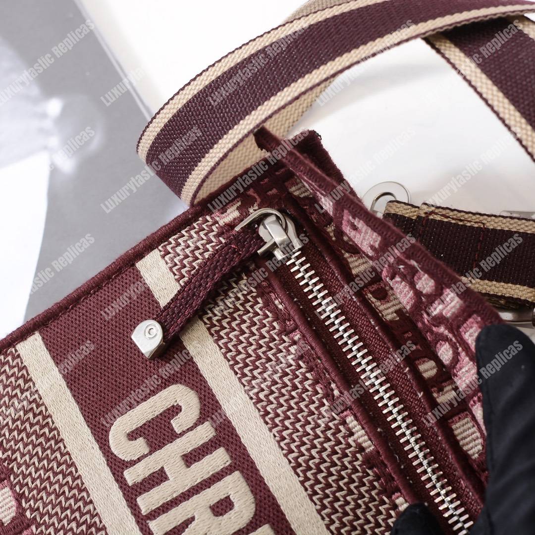 D*or burgundy oblique embroidered canvas clutch