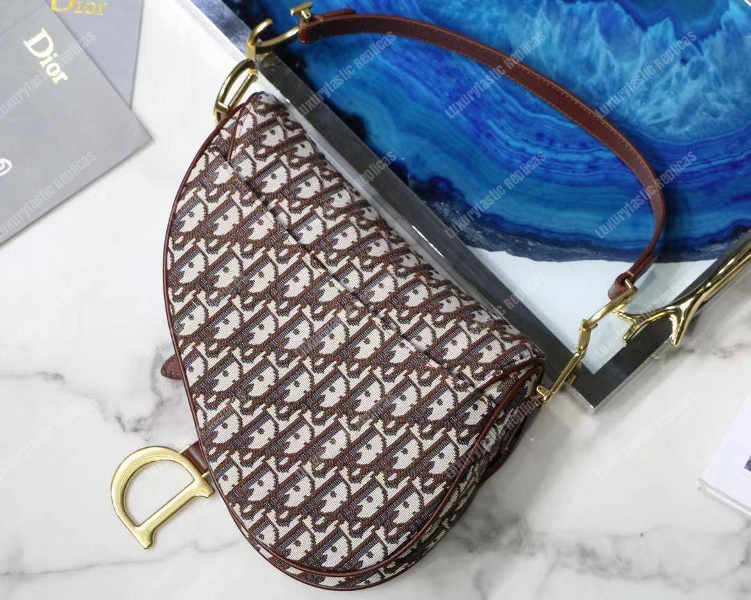 D*or burgundy oblique saddle bag