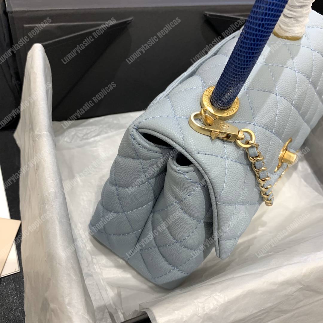 Ch*el flap bag with top handle caviar leather sky blue