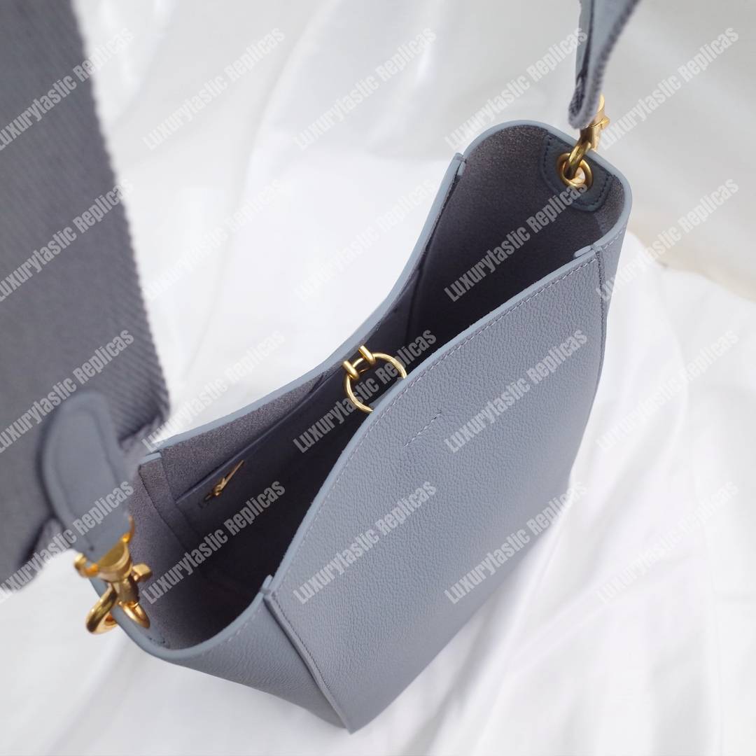 Ce**e sangle small bucket bag in soft grained calfskin cloud