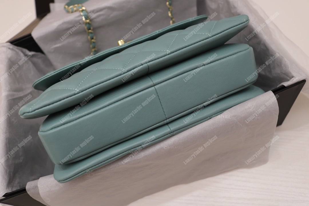 Ch*el small flap bag with top handle light blue-gold