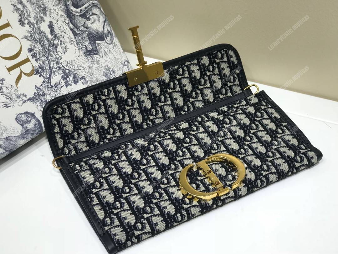 30 Montaigne Jacquard Canvas Clutch Bag Blue