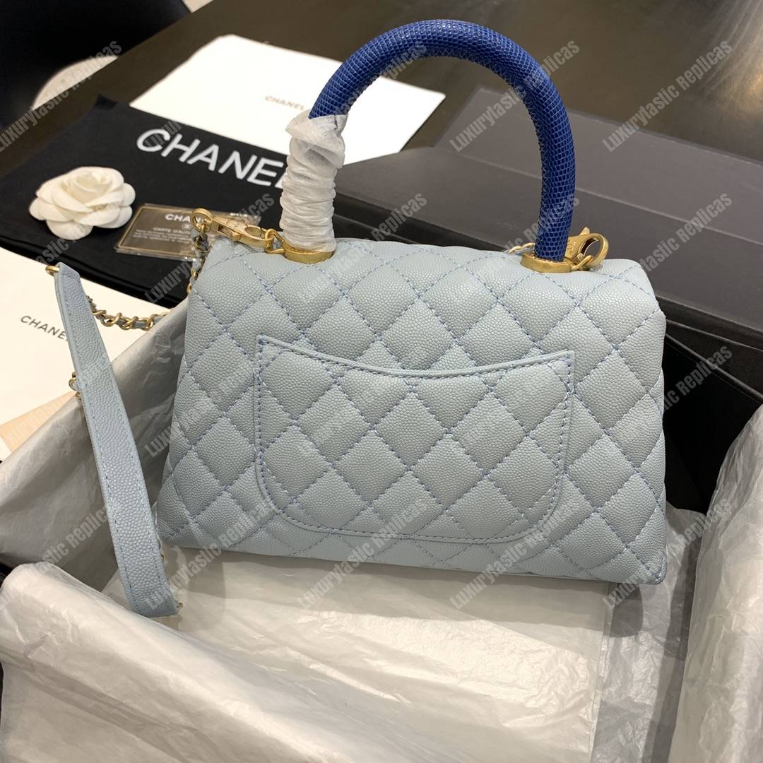 Ch*el flap bag with top handle caviar leather sky blue