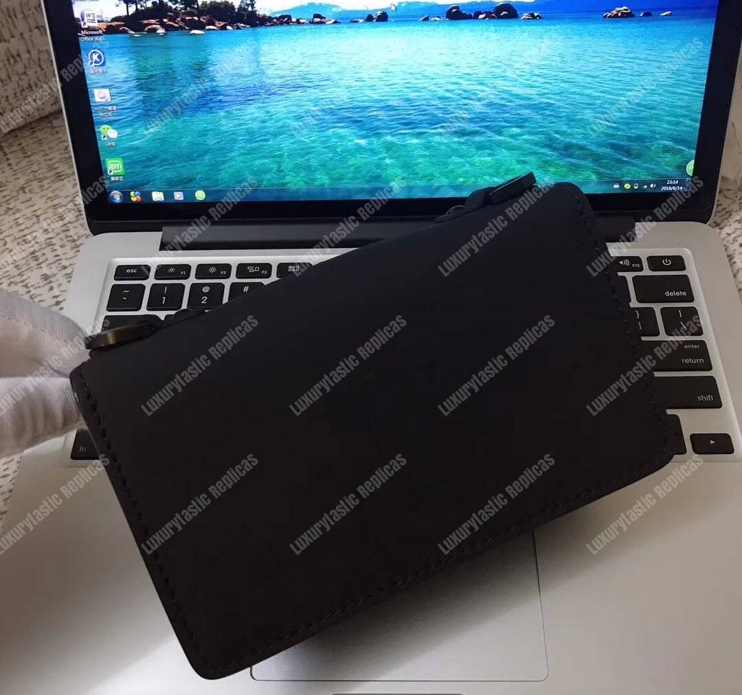 mini j’aD*or flap bag – black calfskin