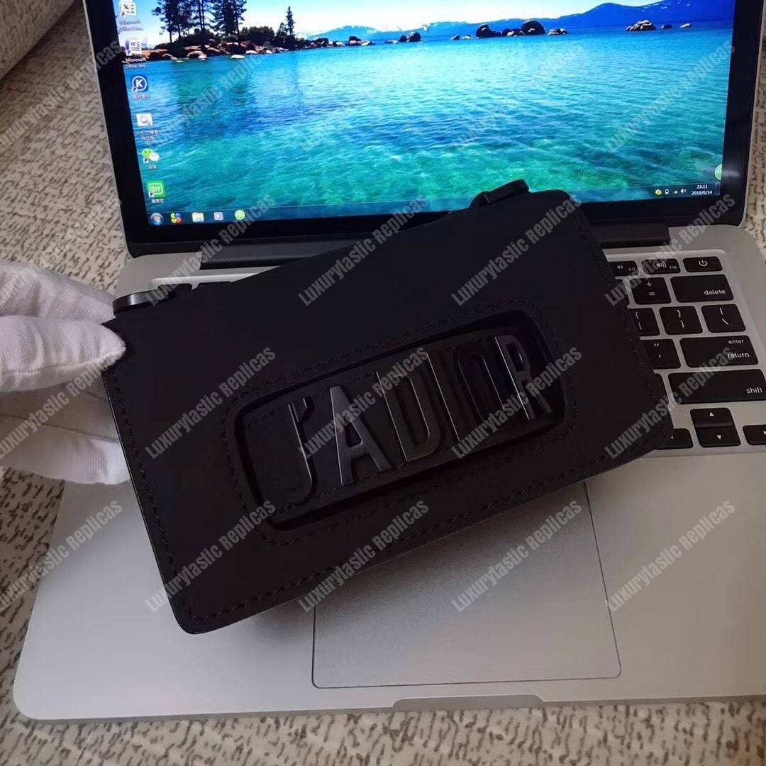 mini j’aD*or flap bag – black calfskin