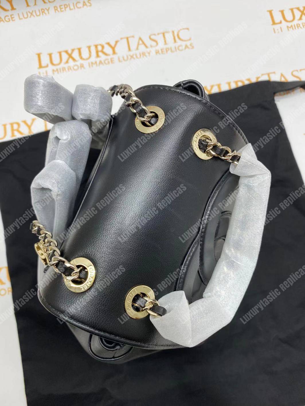 Ch*el lambskin gold-tone metal backpack black