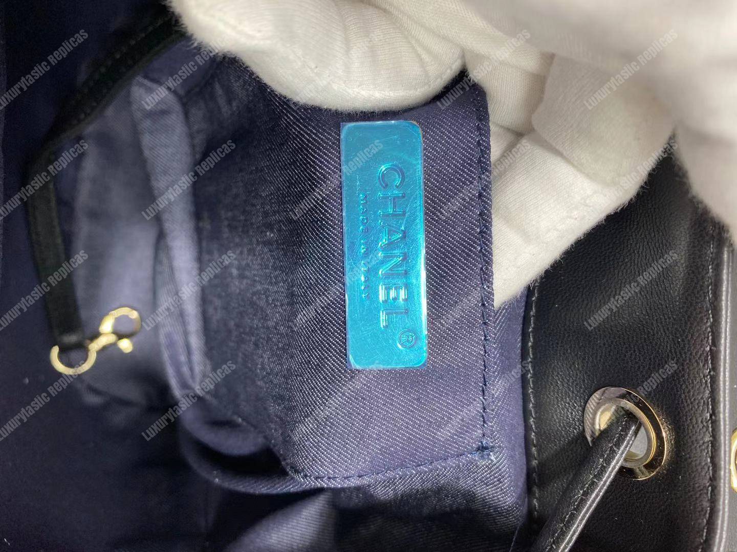 Ch*el lambskin gold-tone metal backpack black