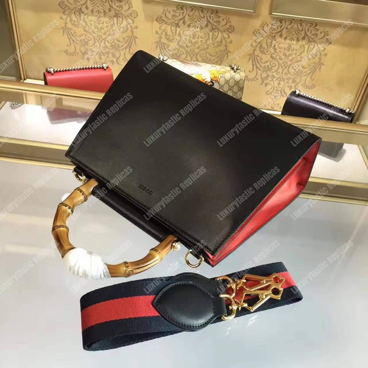 G*u*i nymphaea leather top handle bag