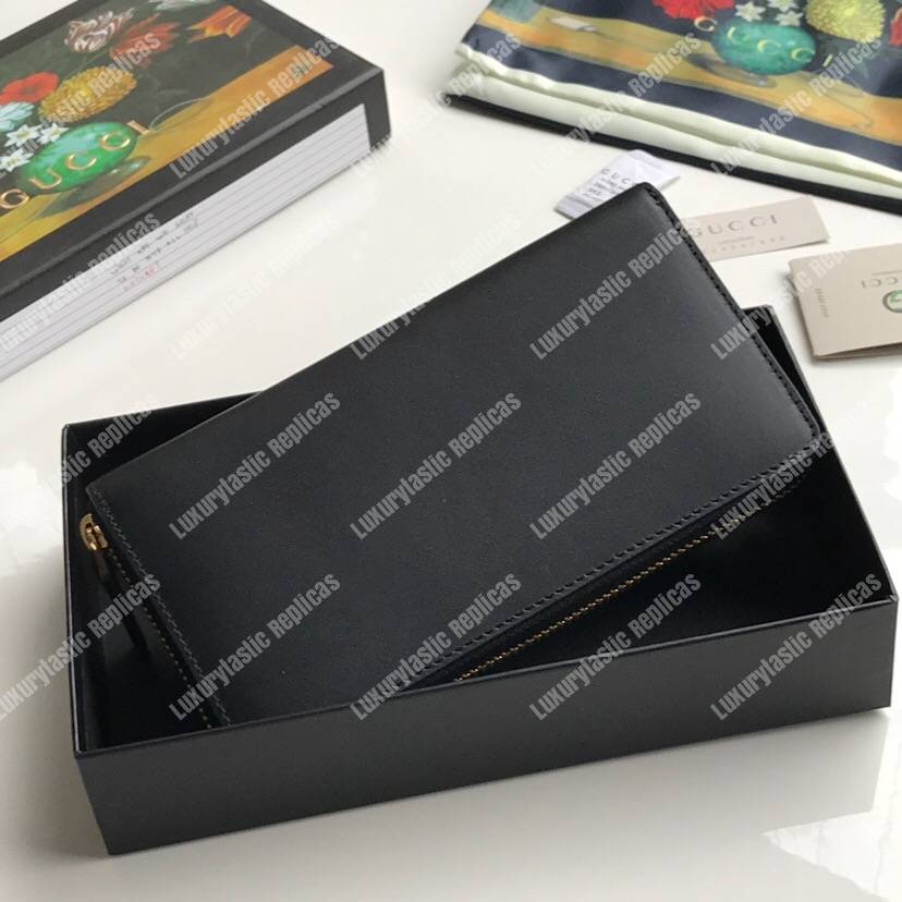 G*u*i leather zip around wallet with G*u*i logo