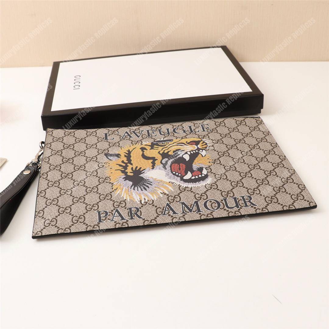 G*u*i tiger print gg sup*e clutch pouch