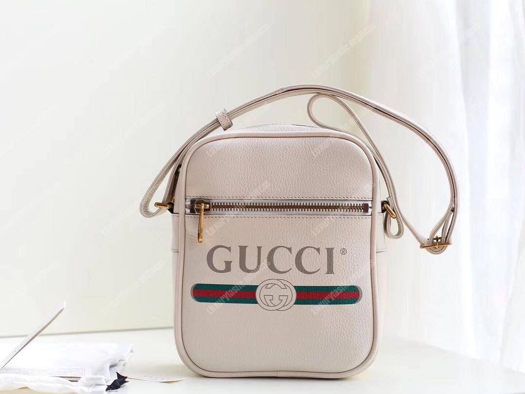 G*u*i print messenger bag white leather