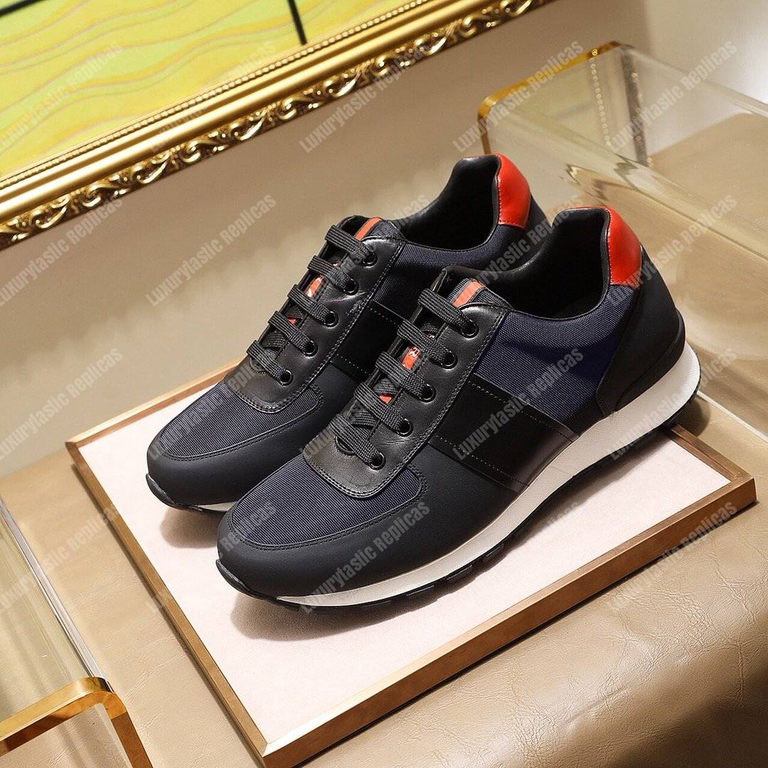 Pra*a fabric and leather sneakers blue/black/orange