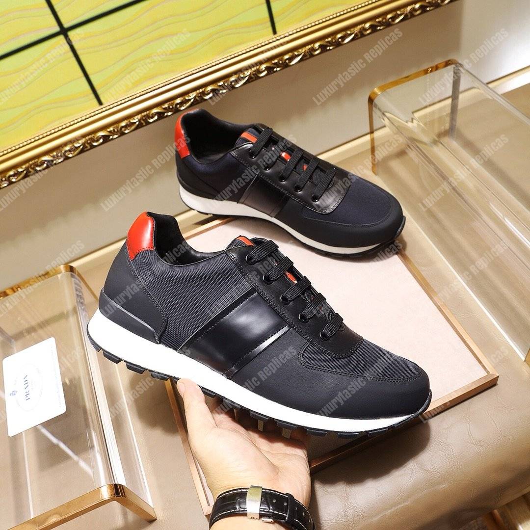 Pra*a fabric and leather sneakers blue/black/orange