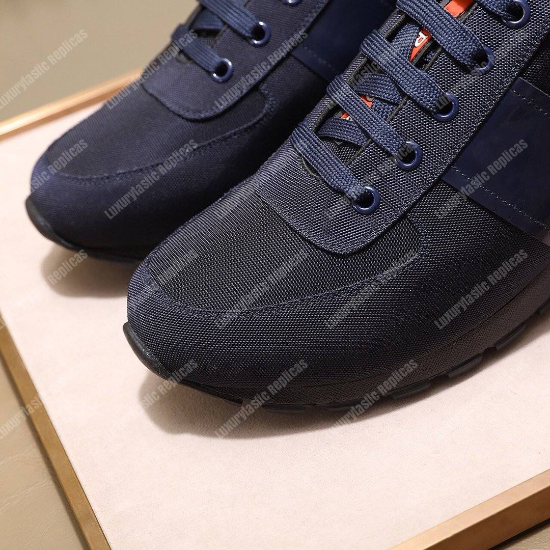 Pra*a fabric and leather sneakers dark blue