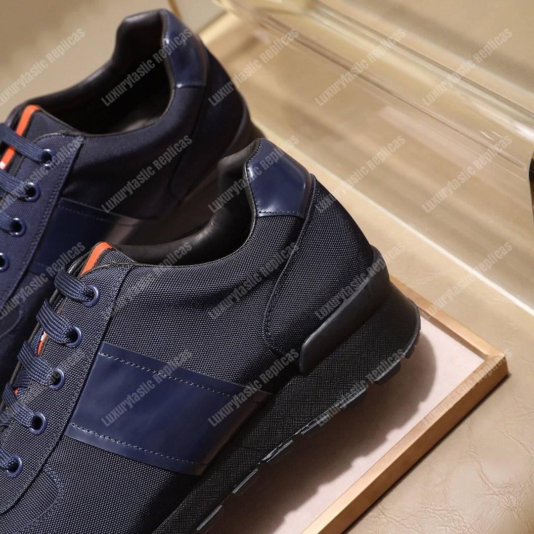 Pra*a fabric and leather sneakers dark blue