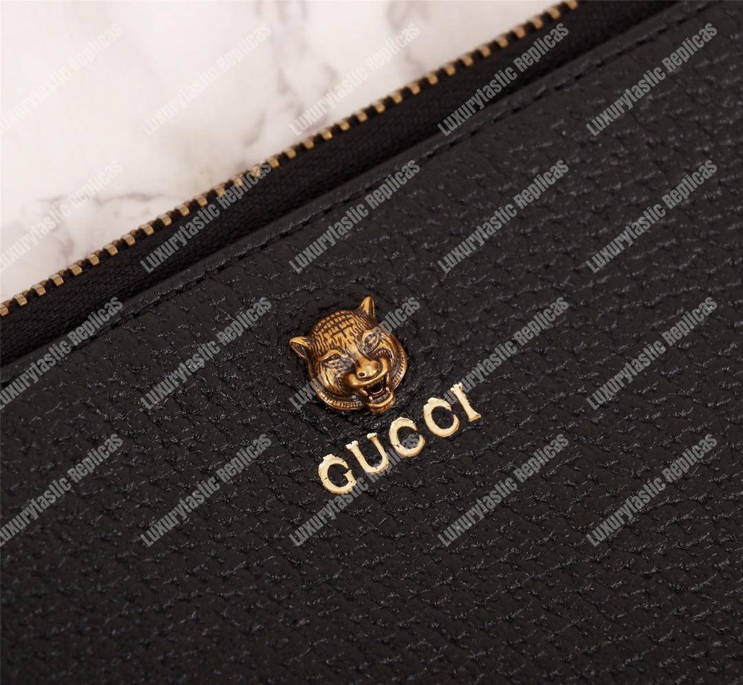 G*u*i animalier leather pouch tiger