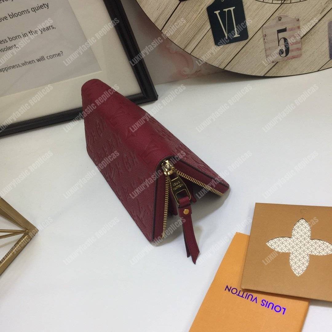 LV Clemence Wallet Monogram Empreinte Leather Aurore