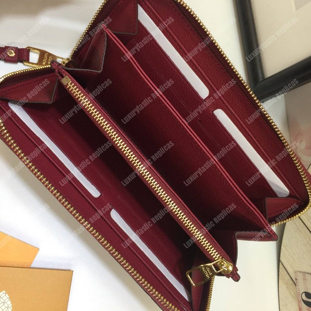 LV Clemence Wallet Monogram Empreinte Leather Aurore