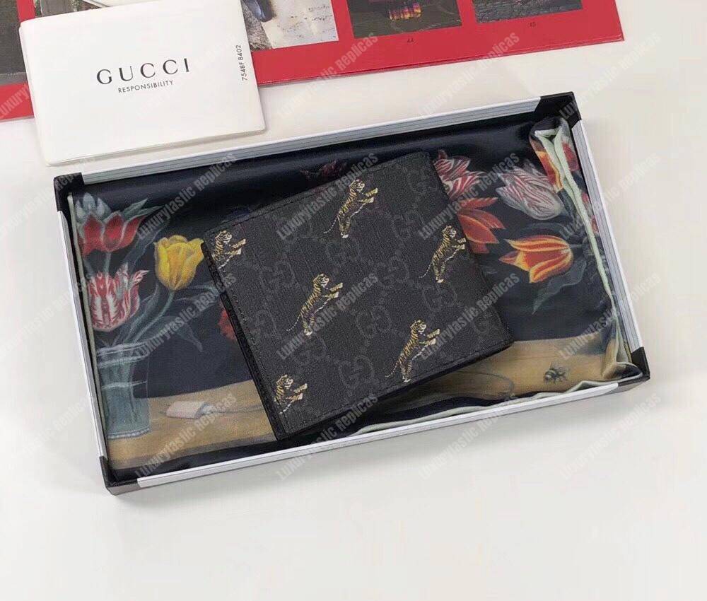 G*u*i gg wallet with tiger print