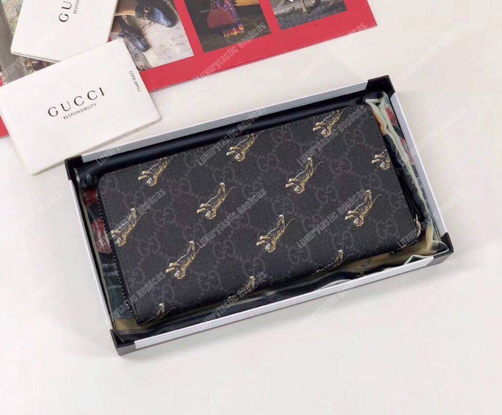 G*u*i gg zipped wallet with tiger print