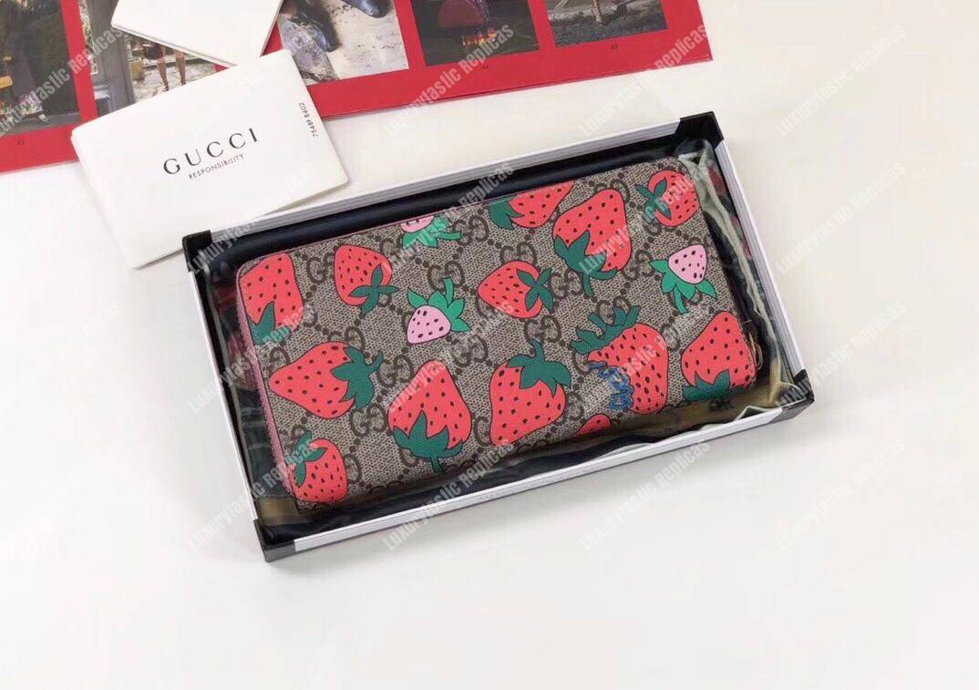 G*u*i gg wallet with G*u*i strawberry print