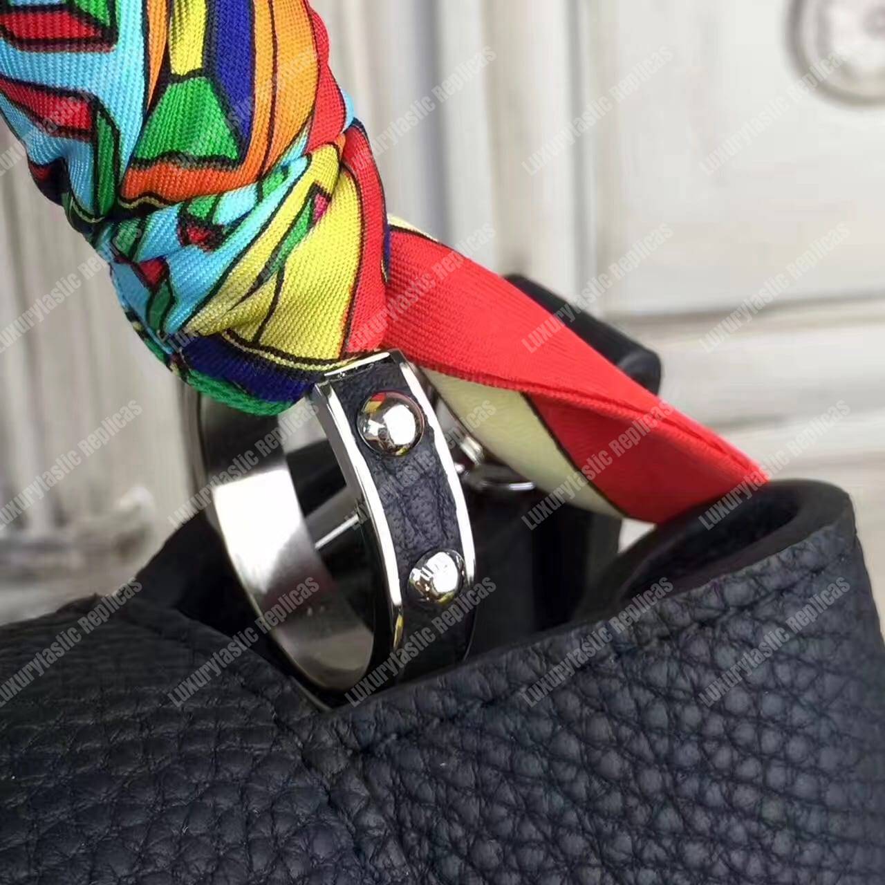 LV Capucines PM Python