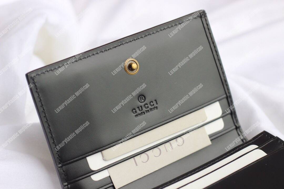 G*u*i signature card case with cat