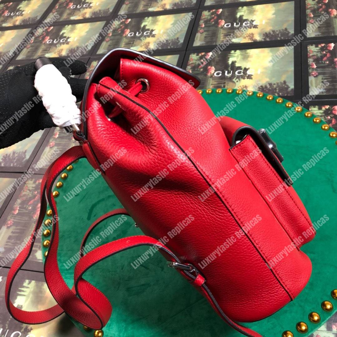 G*u*i leather bamboo tassel backpack hibiscus red