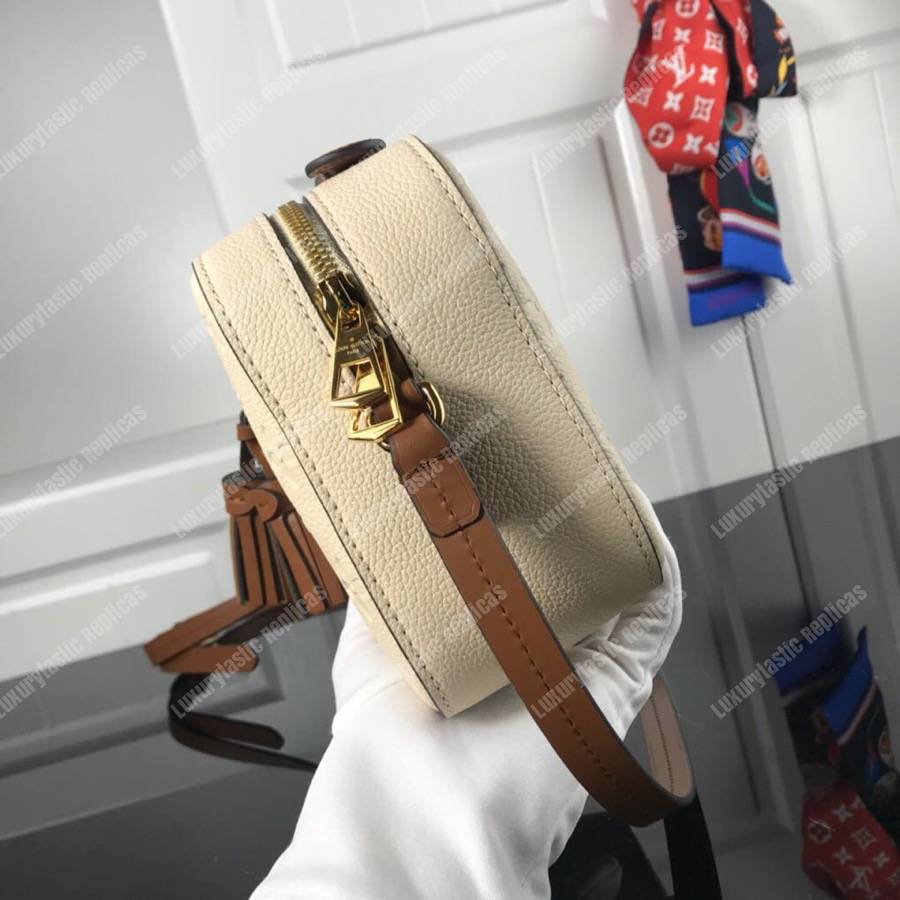 LV Saintonge Monogram Empreinte Leather Creme Caramel