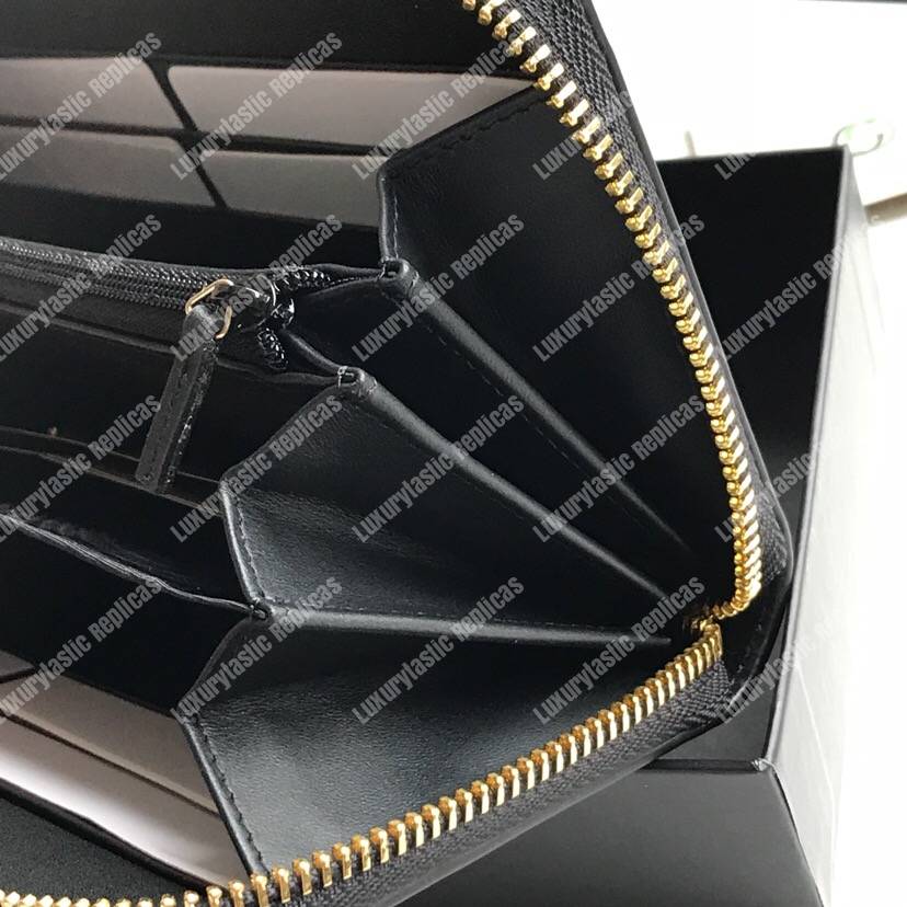 G*u*i leather zip around wallet with G*u*i logo