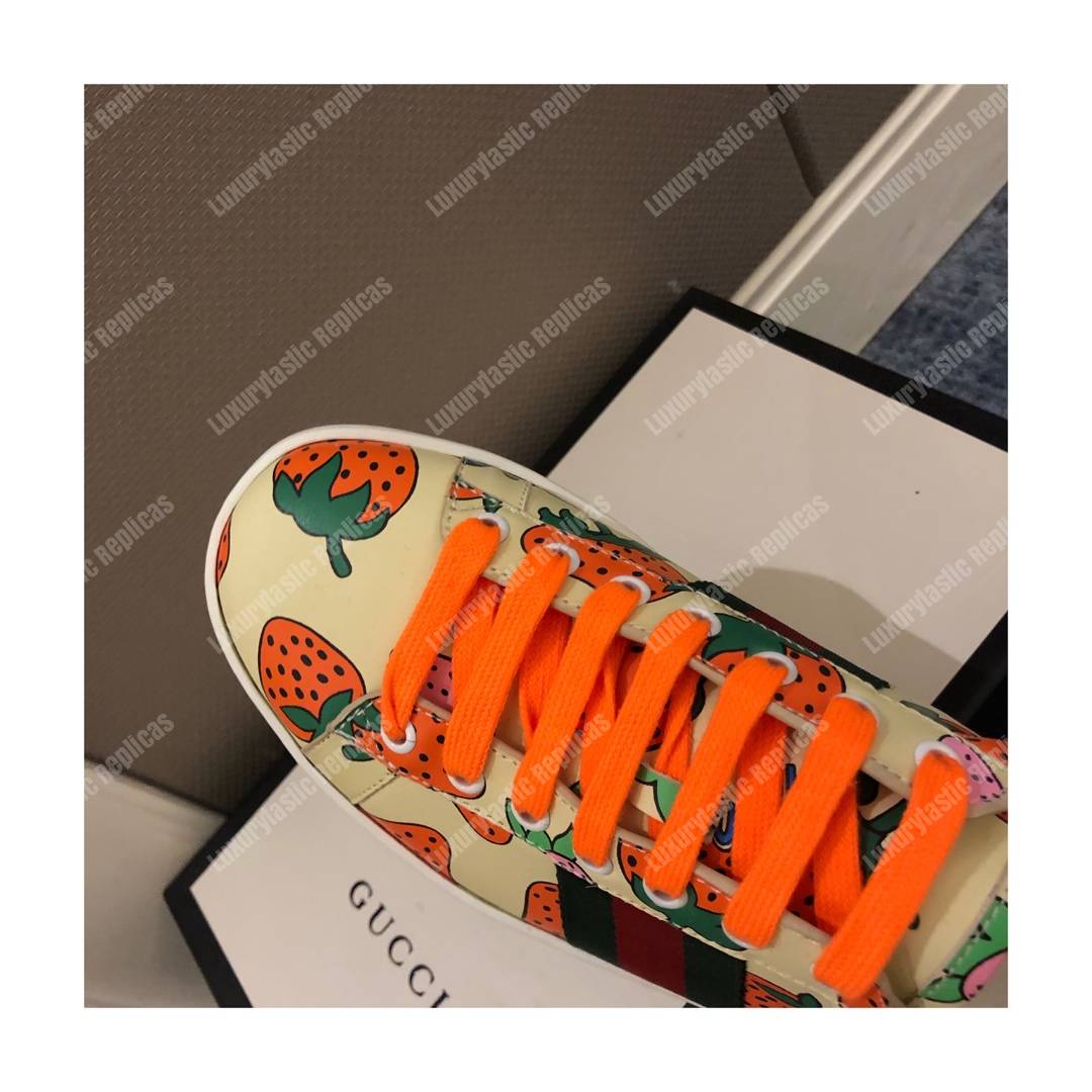 G*u*i ace sneaker with G*u*i strawberry print
