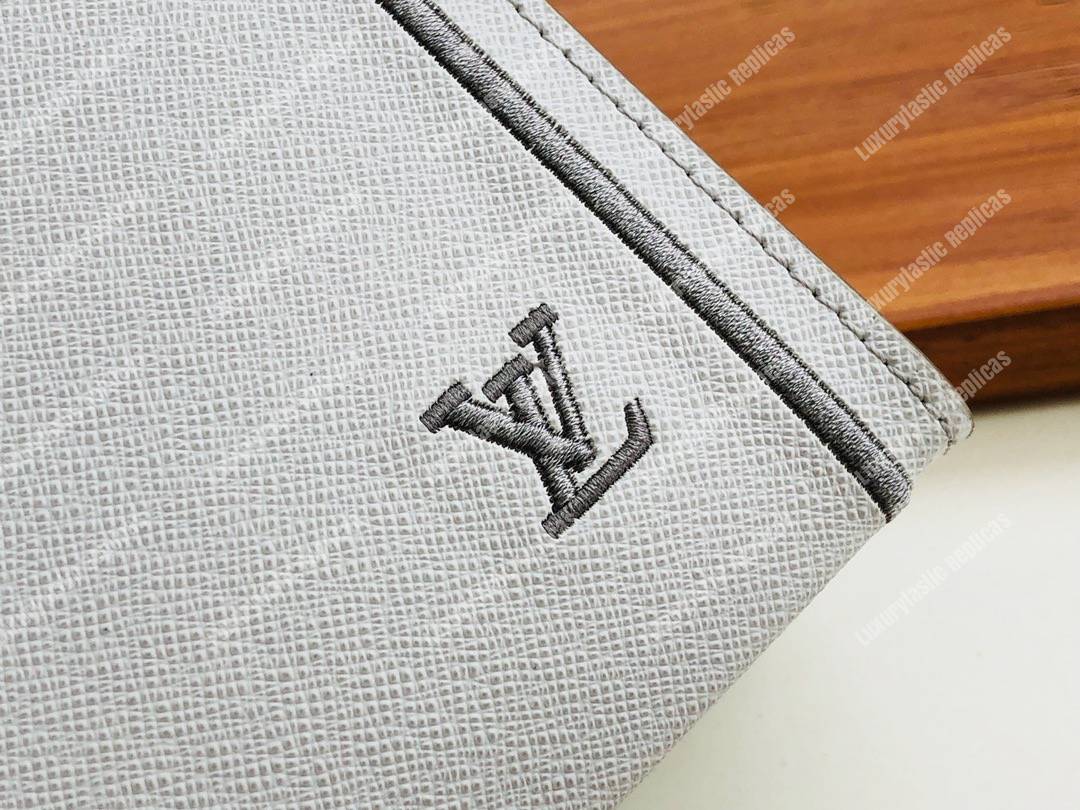 LV Pochette Voyage MM Taiga Leather White
